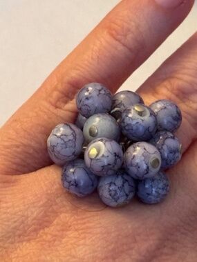 Beaded cluster, adjustable ring in lavender color.